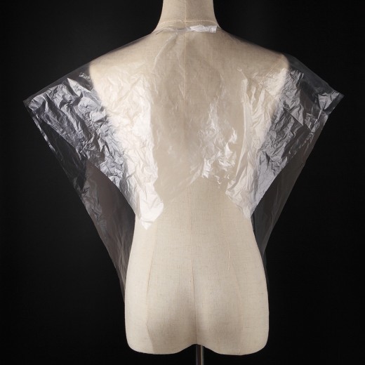 Disposable plastic shawl in barber shop